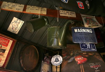 2015-10 Shea's (10) Vintage oil cans and signs hang from the ceiling inside the former Mahan's filling station on the museum property seen Thursday, Oct. 1, 2015. A series of three...