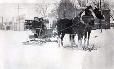 1912 Geary - two women riding through snow in a horse-drawn sleigh near North Broadway Avenue