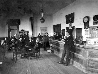 1909 Shamrock - Pendleton Drug Store on East side of Main Street, 'Sporty' Pendleton at end of Bar with cigar