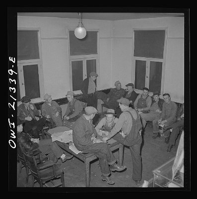 1943 Seligman Railroad men lounging in the lobby of the Harvey House near the Atchison, Topeka, and Santa Fe Railroad yard