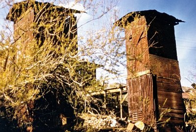 19xx Oatman - Double Decker Outhouses behind the Walsh building 1